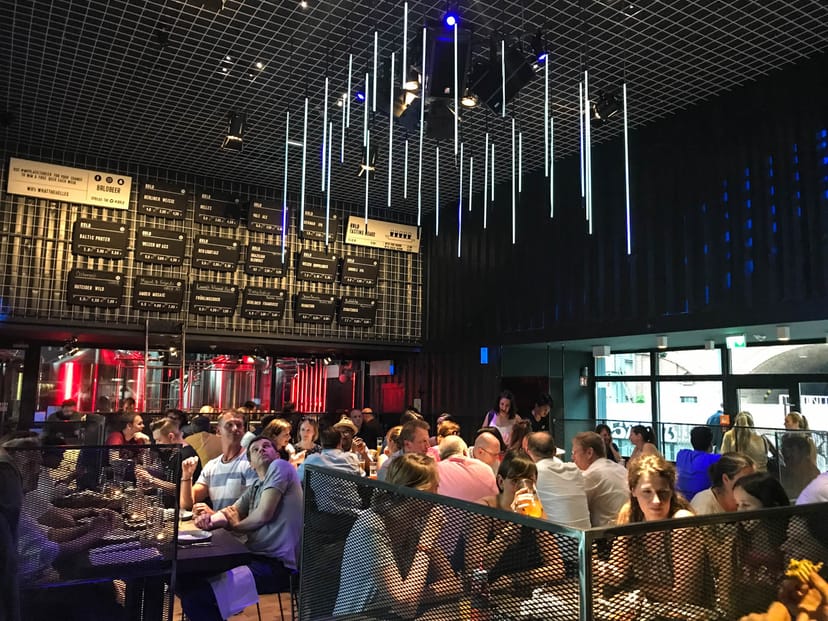 Vibrant dining space at BRLO BRWHOUSE, ideal for corporate events and team-building dinners.