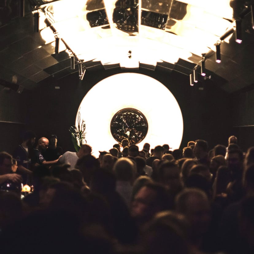 "Bar Tausend event space with circular feature, perfect for social gatherings and celebrations."