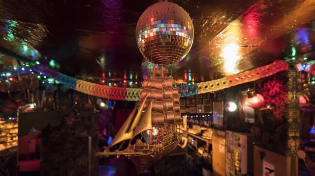 Vibrant Kumpelnest 3000 bar with disco ball, ideal for themed parties and gatherings.