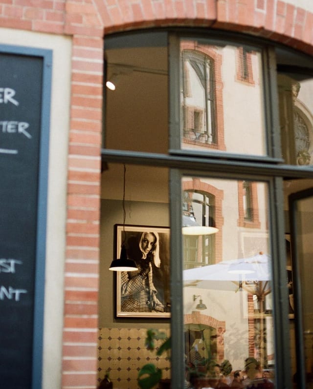Cafe Space at Father Carpenter with large windows, perfect for meetings and events.