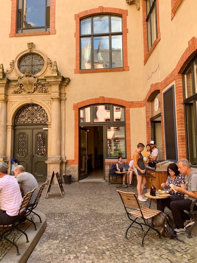 Cafe Space at Father Carpenter: vibrant outdoor event venue with charming architecture.
