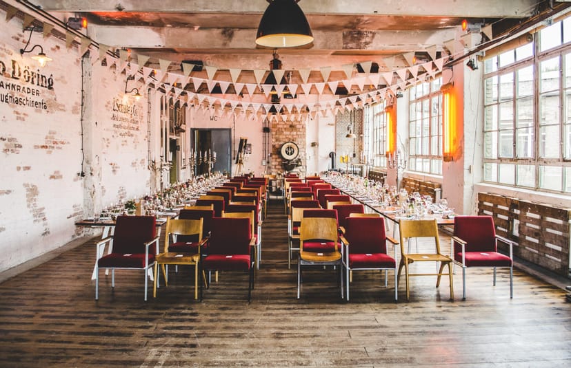 Versatile Werkloft event space with rustic brick walls for workshops and networking.