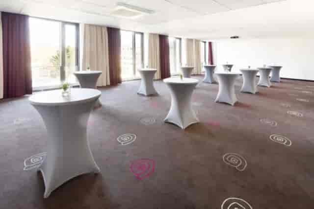 Modern event space at Mercure Hotel MOA Berlin for networking and cocktail receptions.