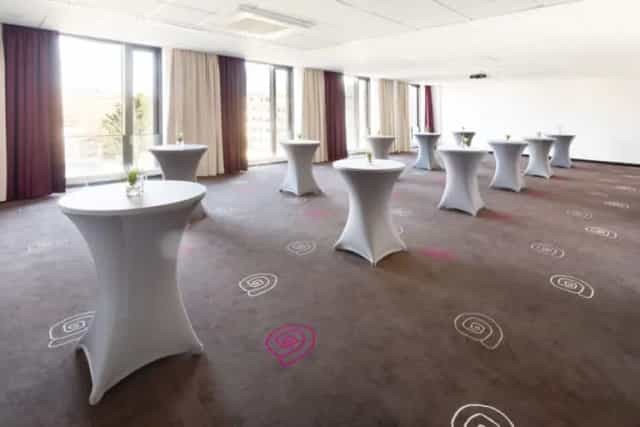 Modern event space at Mercure Hotel MOA Berlin for networking and cocktail receptions.