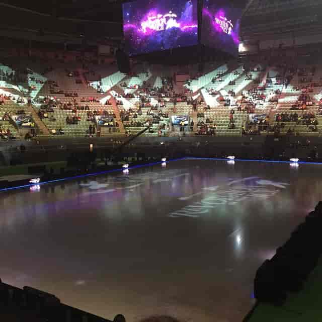 Ice rink at Palacio Vistalegre for figure skating competition event with soft lighting.