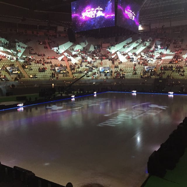 Ice rink at Palacio Vistalegre for figure skating competition event with soft lighting.
