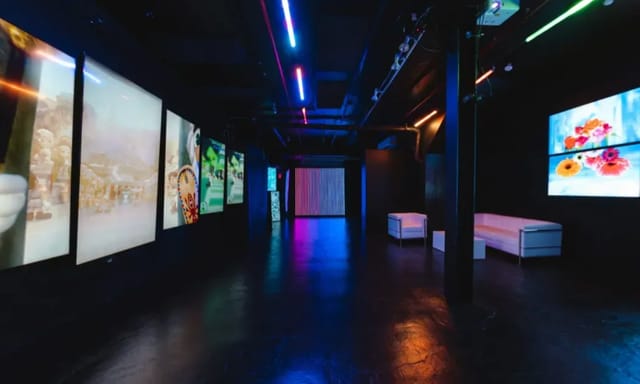 Modern Blackout Studio with vibrant lighting, ideal for corporate and creative events.