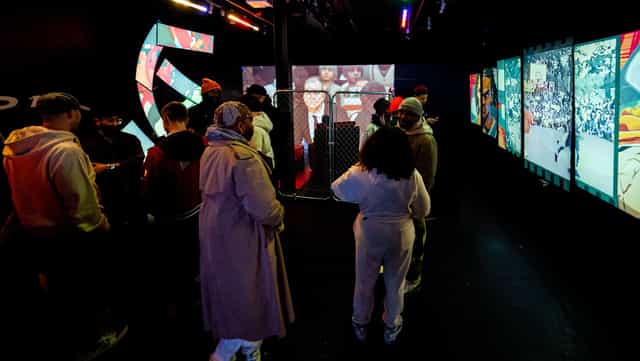 Dynamic event space at Blackout Studio with immersive displays for networking and presentations.