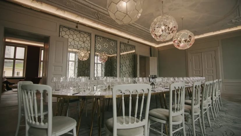 Elegant banquet hall with artistic lighting for corporate events and meetings.