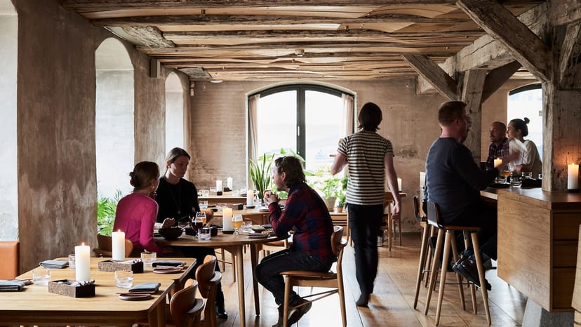 Private dining room with warm ambiance for intimate gatherings and networking events.