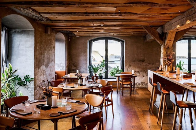 Private dining room with rustic beams, ideal for intimate dinners or corporate retreats.