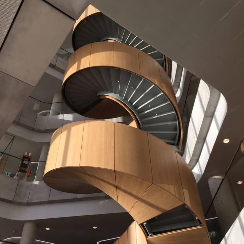 Modern spiral staircase in Nielsine Nielsen Auditorium, event space for networking and photos.
