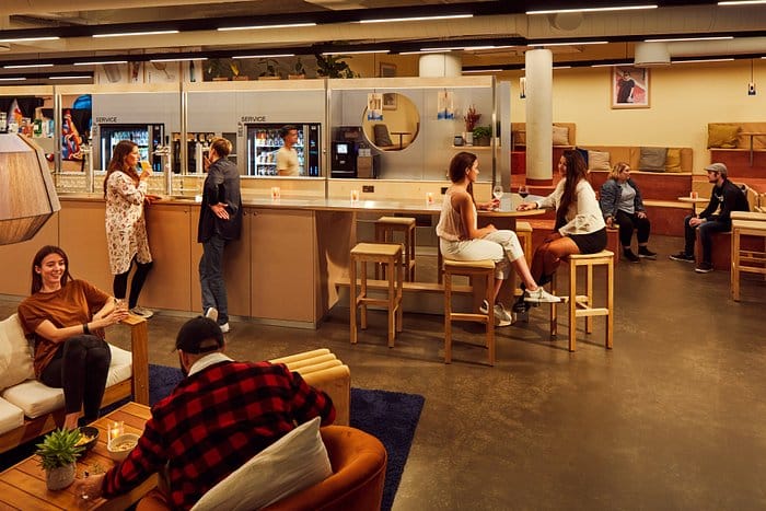 Modern event space in CityHub Copenhagen with cozy seating for networking and gatherings.