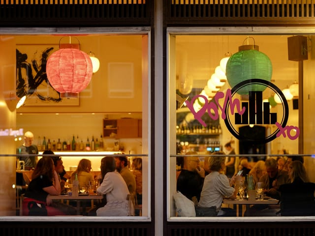 Vibrant Coco Hotel dining space with colorful lanterns for social gatherings.
