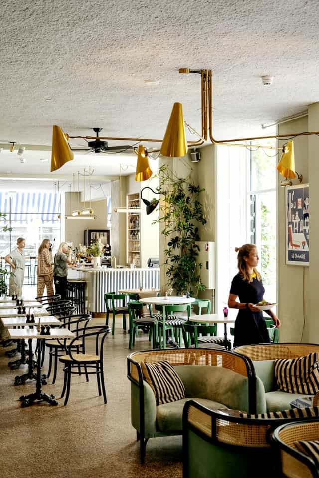 Modern Coco Café in Coco Hotel, perfect for meetings and casual events with greenery.