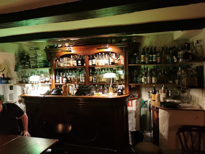 Cozy Balderdash bar with warm lighting, ideal for networking and social events.
