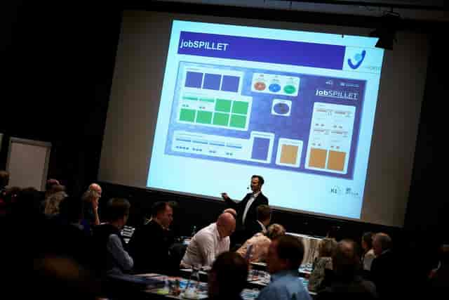 Copenhagen conference showcasing digital jobSPILLET interface for networking and collaboration.