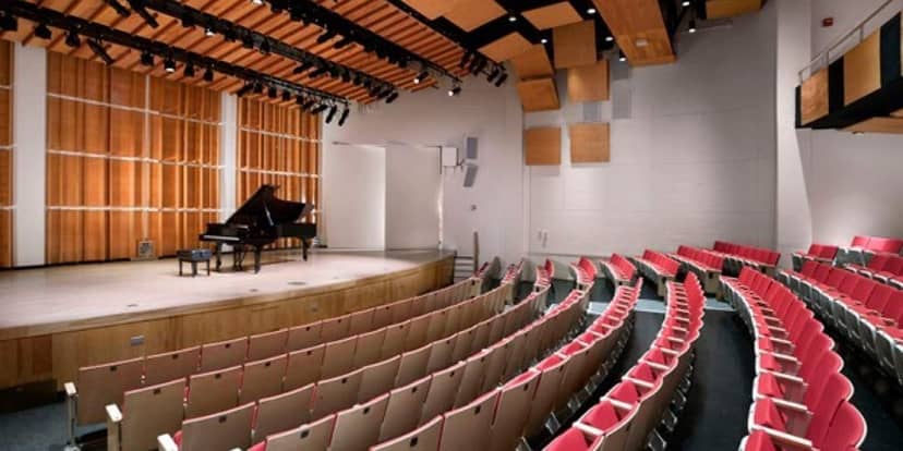 Percussion Hall auditorium with grand piano, ideal for concerts and presentations.