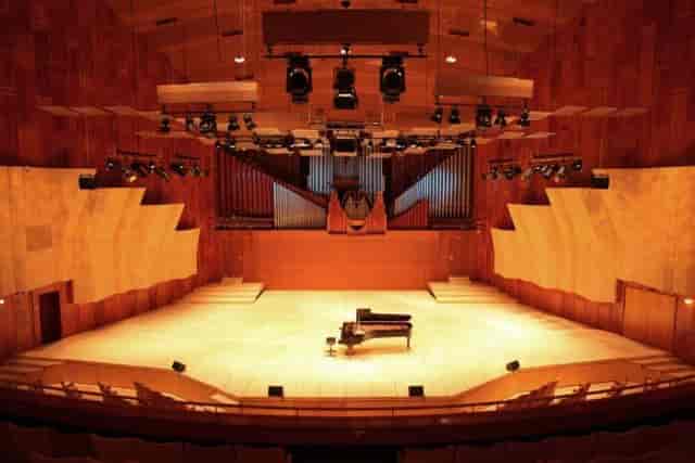 Main Hall at Royal Danish Academy with grand piano, ideal for concerts and events.