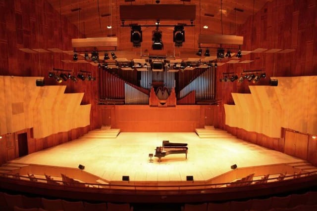 Main Hall at Royal Danish Academy with grand piano, ideal for concerts and events.