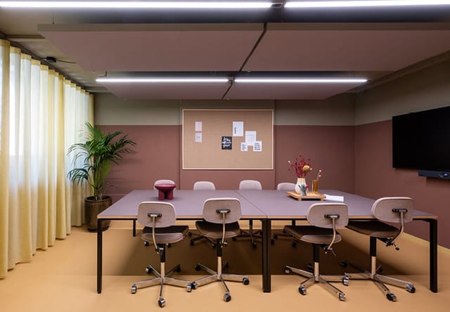 Modern conference room with ergonomic chairs, ideal for meetings and collaboration.