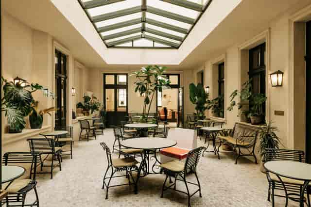 Atrium space in Château Royal Hotel Bar for networking events and casual meetings.