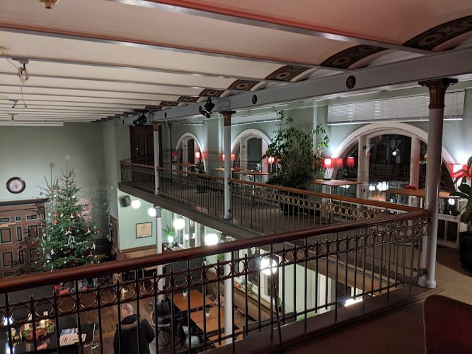 Elegant event space with high ceilings, perfect for networking gatherings and holiday celebrations.