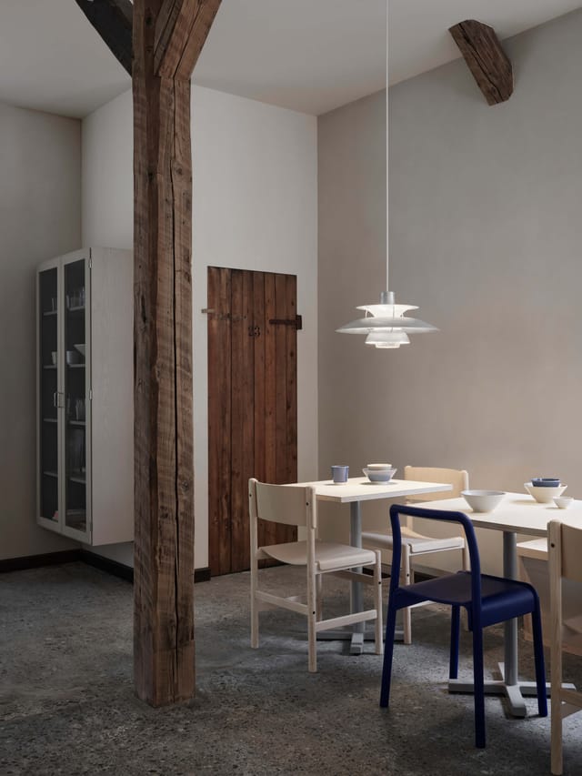 Minimalist dining area in BaneGaarden for intimate meetings and casual gatherings.