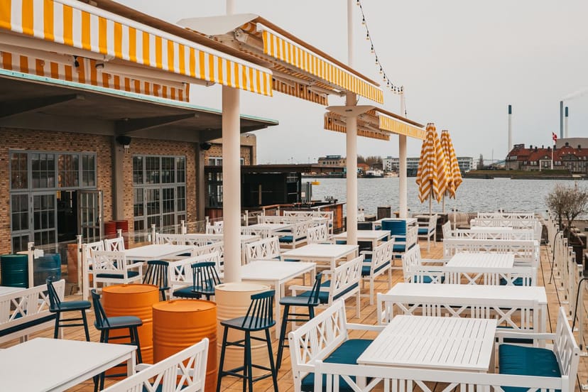 Stylish outdoor venue in Seaside Toldboden with striped awnings for casual events.