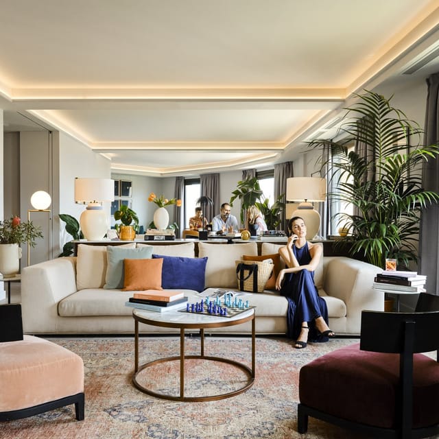 Stylish lounge for informal meetings with plush seating and ambient lighting.