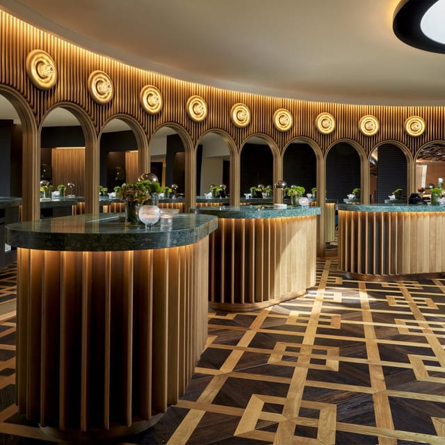 Sophisticated meeting room with curved wooden arches for elegant events and networking.