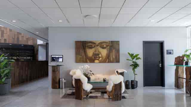 Modern hotel lobby with warm wood accents, ideal for networking events or meetings.