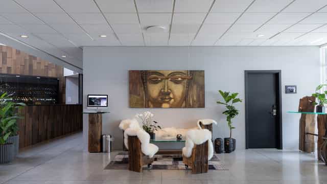 Modern hotel lobby with warm wood accents, ideal for networking events or meetings.
