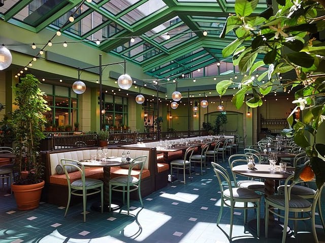 Apollo Courtyard at Copenhagen Jazz Festival 2024, bright venue with glass ceiling for events.