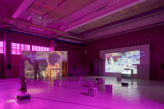 Versatile Copenhagen Contemporary foyer with pink ambient lighting for innovative events.