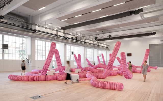 Interactive art installation in vibrant pink at Copenhagen Contemporary event space.