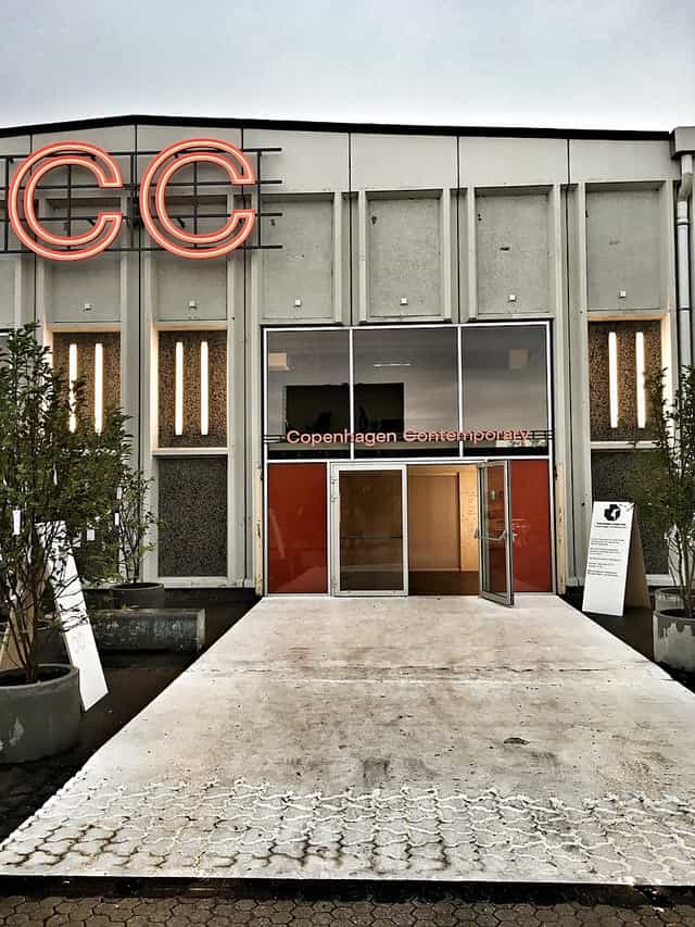 Copenhagen Contemporary entrance with sleek glass doors, ideal for art events and exhibitions.