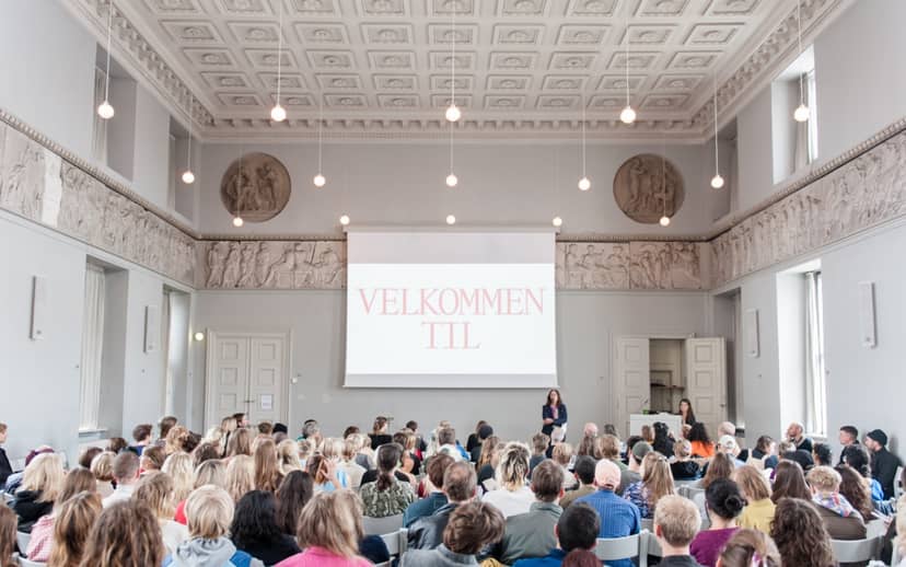 International school seminar in elegant Assembly Hall with ornate architecture.