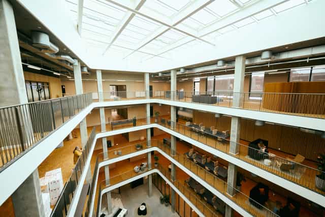 Modern open office atrium in Innovation House, ideal for networking events and meetings.