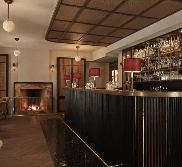 Stylish hotel bar with modern decor, ideal for cocktail receptions and networking events.