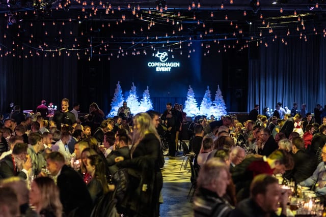 Lively Main Venue at The Plant Cph with elegant tables for a festive event.