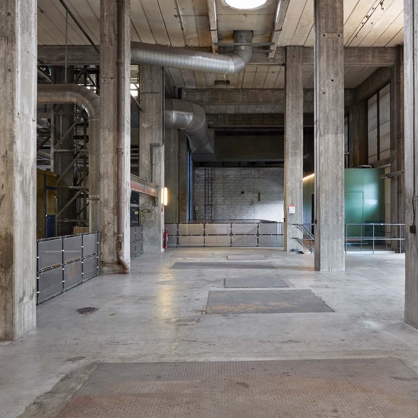 Spacious industrial venue with concrete walls for creative events in The Plant Cph.