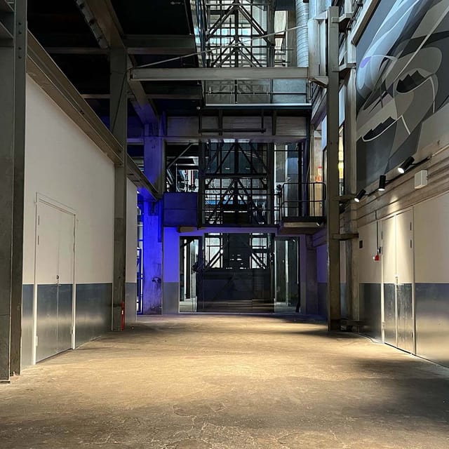 Spacious industrial venue with high ceilings for versatile corporate events at The Plant Cph.