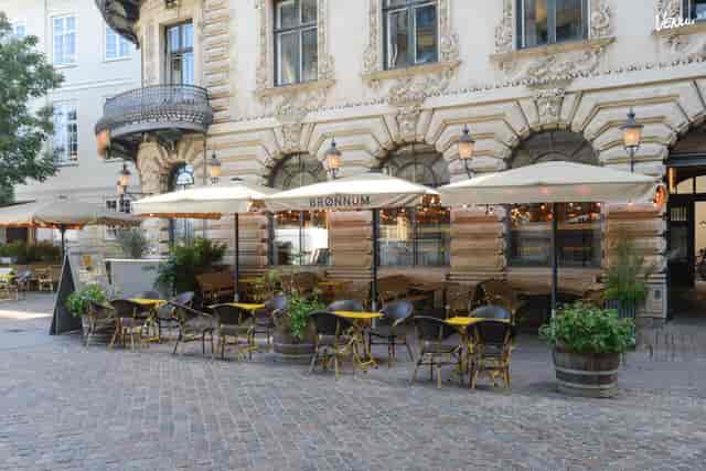 Outdoor café in Brønnum with umbrellas, ideal for casual meetings and networking events.