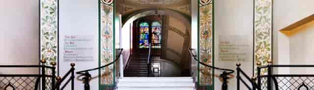 Elegant staircase and archway in Museum of Copenhagen, perfect for upscale events.