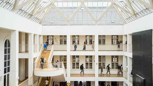 Modern Forhallen atrium, glass roof, perfect for networking events and conferences.