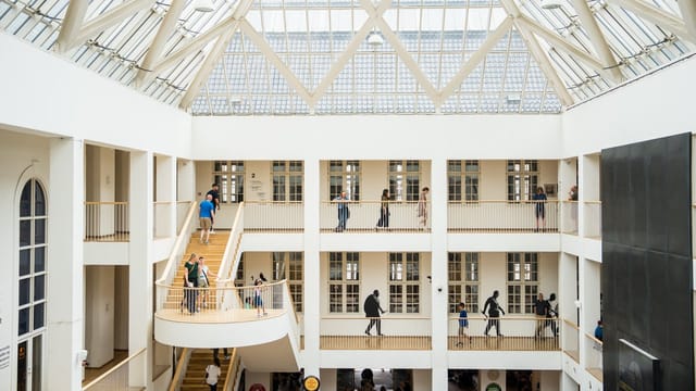 Modern Forhallen atrium, glass roof, perfect for networking events and conferences.