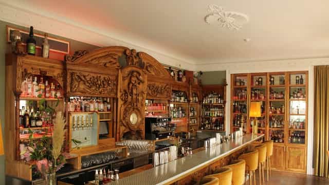 Elegant wooden bar in The Jane, perfect for social gatherings and private events.