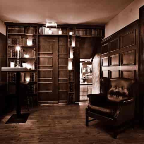 Elegant meeting space with rich wood paneling, ideal for networking events and gatherings.