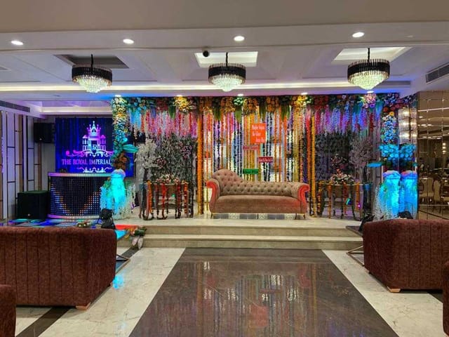 Vibrant Main Hall event space with colorful drapery for celebrations and performances.